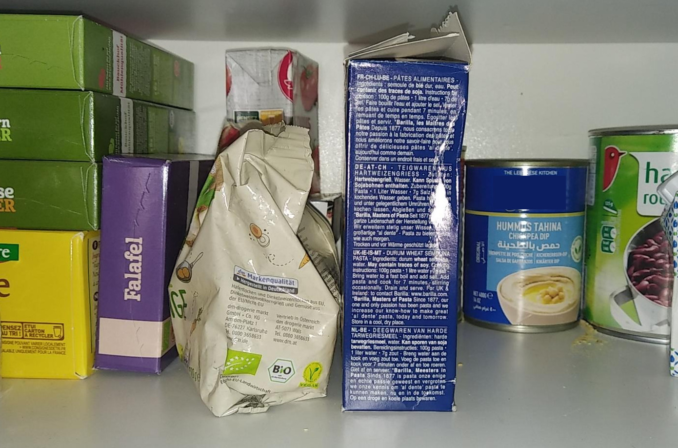 To illustrate low cohesion. A picture of packs of food. A box of falafel preparation, some other boxes, and then a can of hummus.